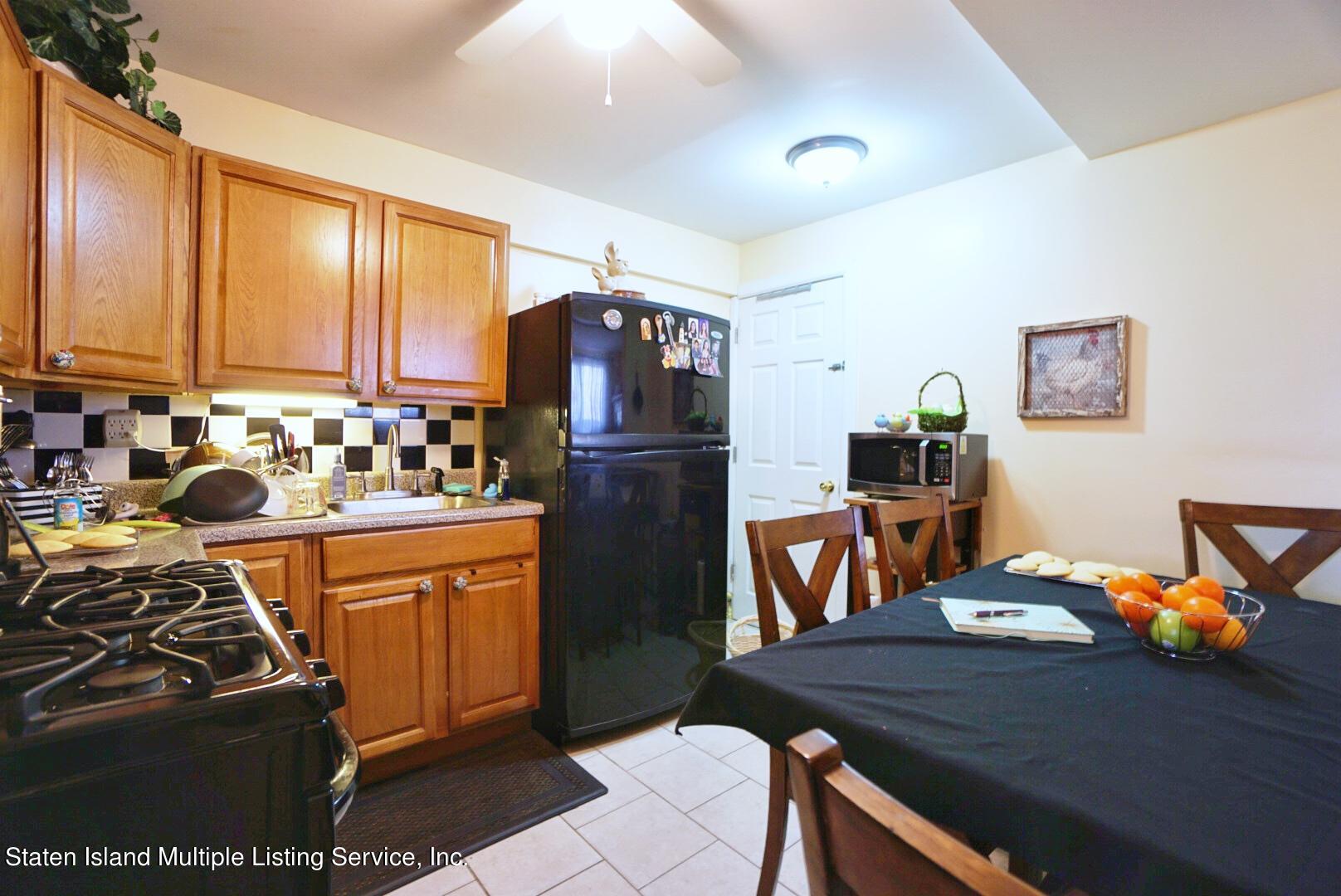 563 Mill Road Staten Island, NY 10306 - Photo 27 of 32 a kitchen with stainless steel appliances granite countertop a refrigerator stove and sink