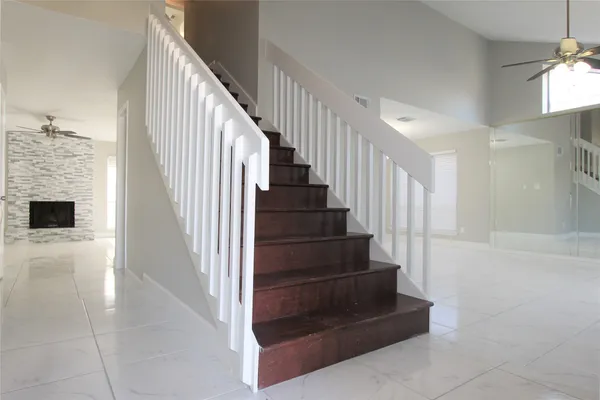 a view of entryway and hall with wooden floor