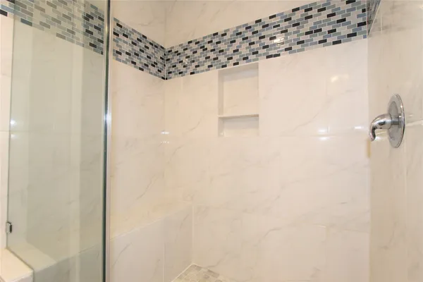 a bathroom with a sink vanity and a mirror