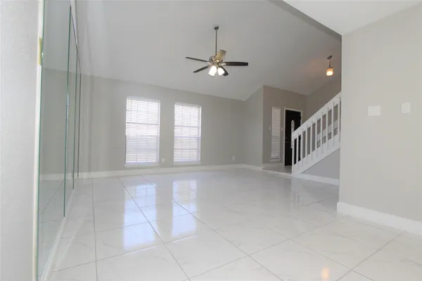 a view of an empty room with a window