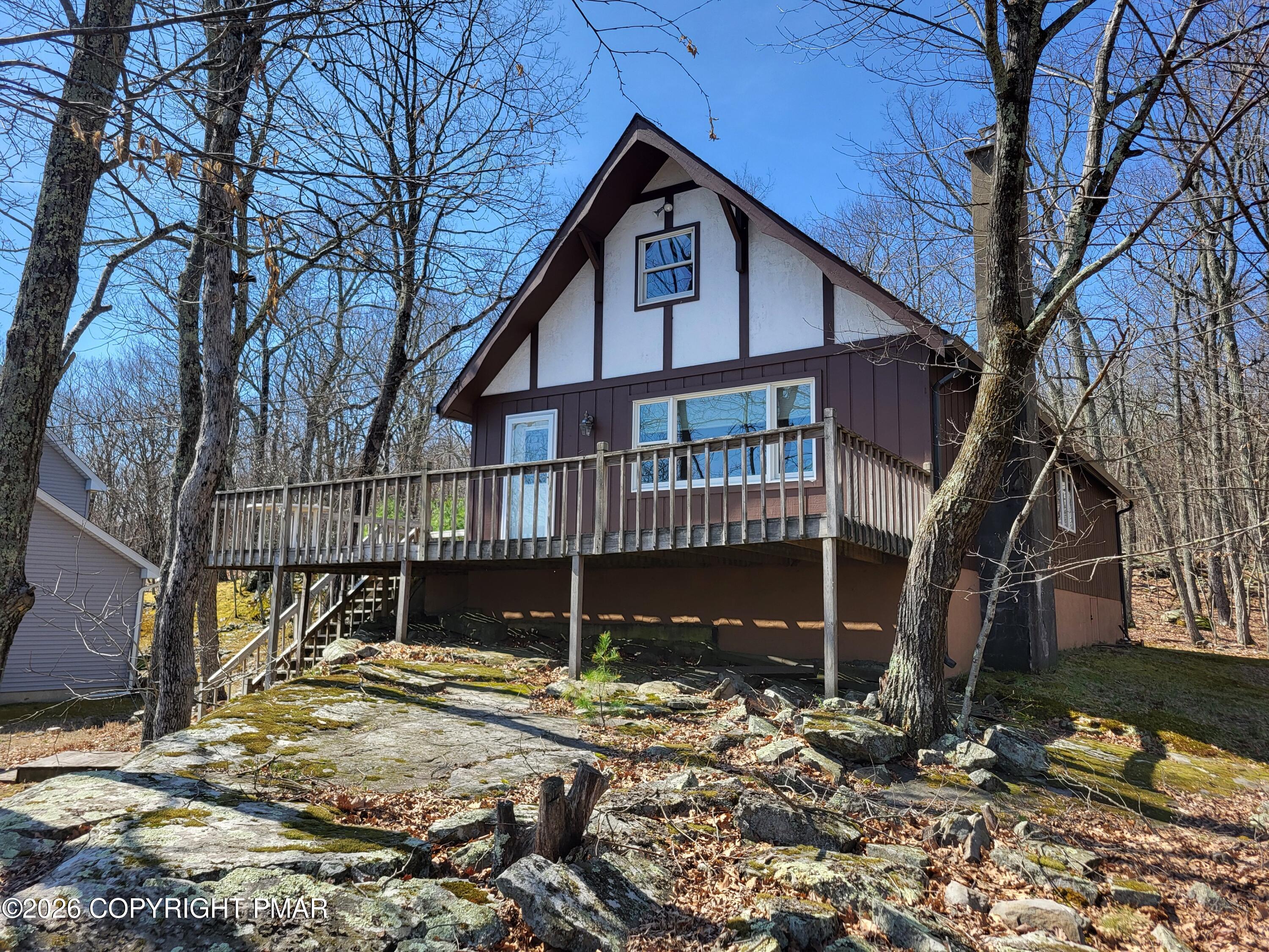 155 Clifton Drive Bushkill, PA 18324 - Photo 1 of 75 a front view of a house with a yard