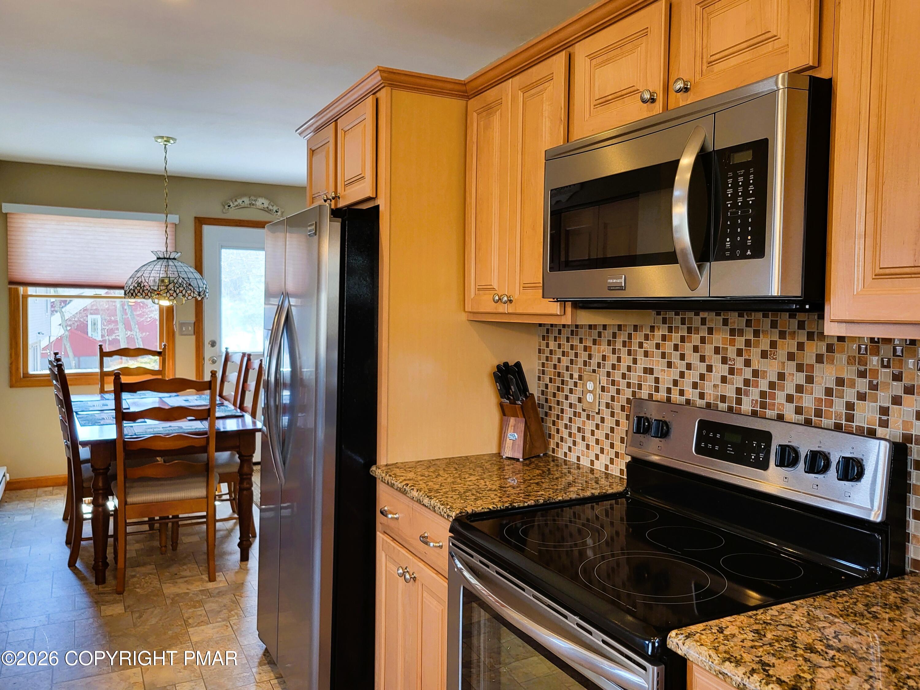 155 Clifton Drive Bushkill, PA 18324 - Photo 13 of 75 a kitchen with a stove and a microwave