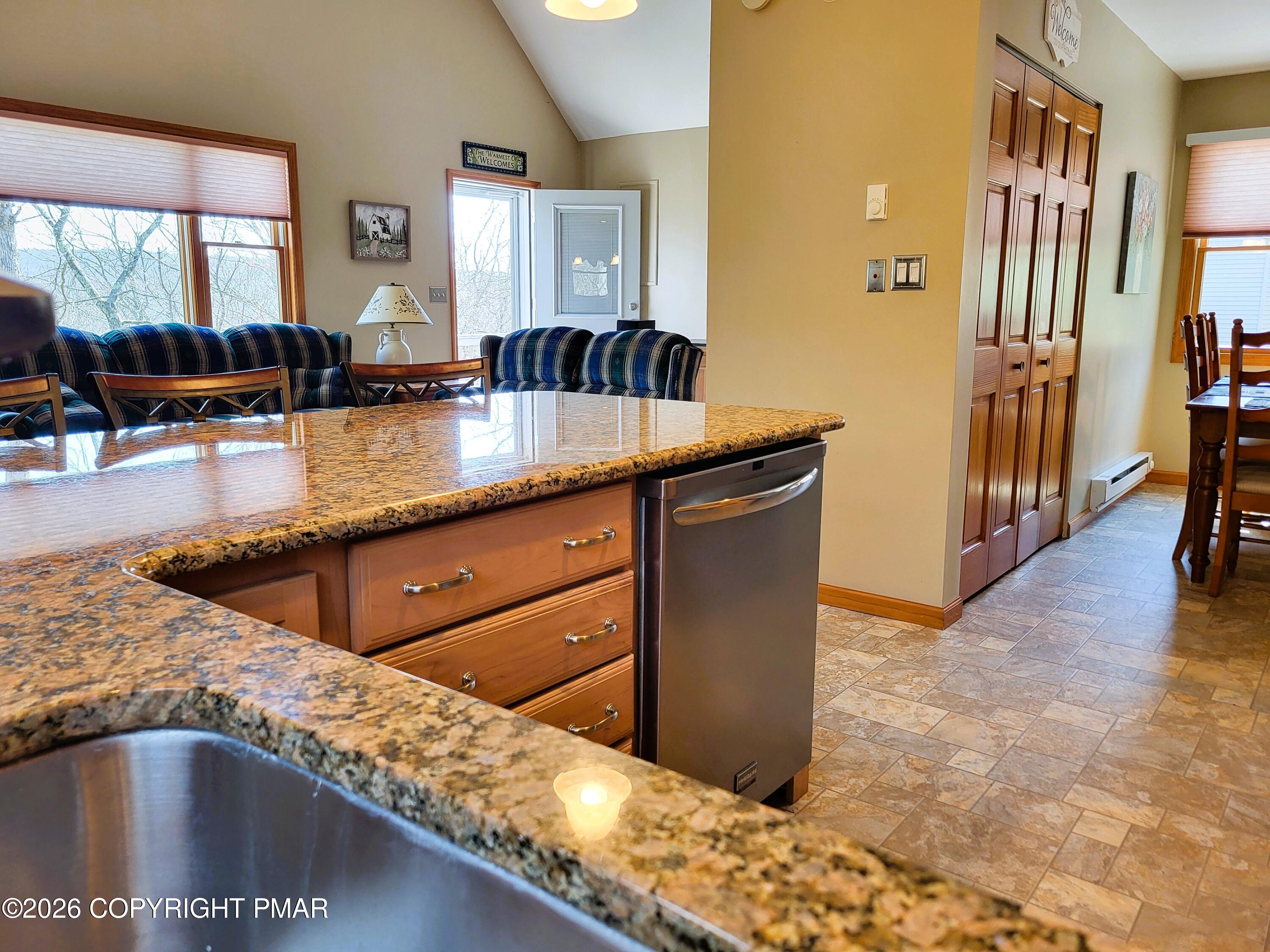 155 Clifton Drive Bushkill, PA 18324 - Photo 14 of 75 a kitchen with granite countertop a sink and a counter top space