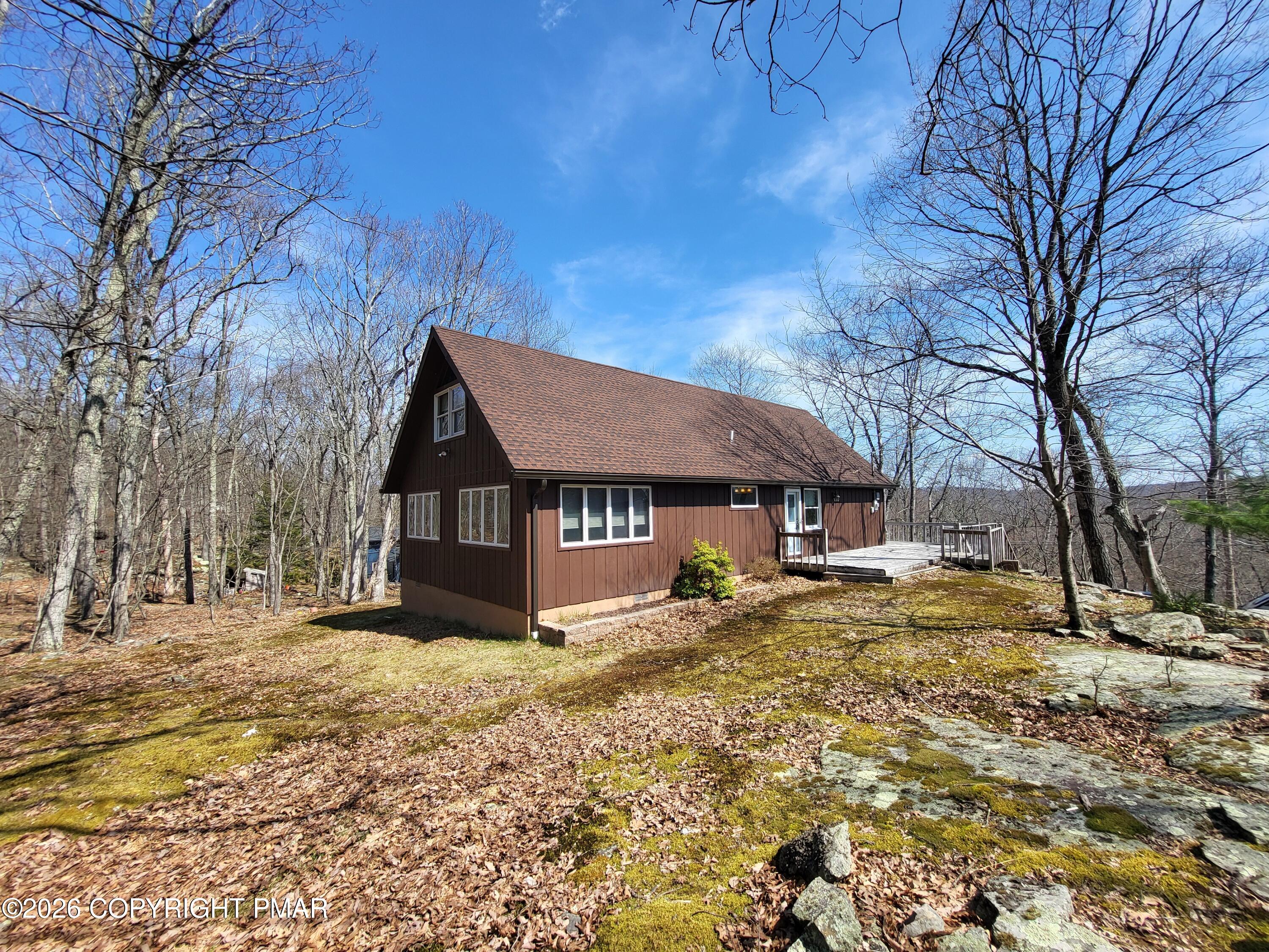 155 Clifton Drive Bushkill, PA 18324 - Photo 2 of 75 a view of a house with a yard covered in snow