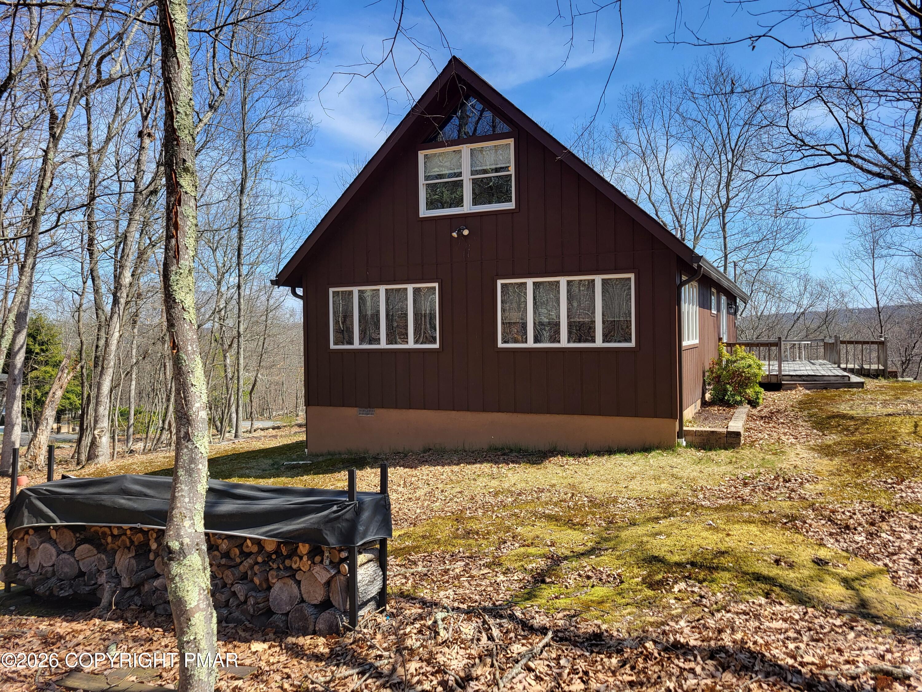 155 Clifton Drive Bushkill, PA 18324 - Photo 42 of 75 a front view of a house with a yard