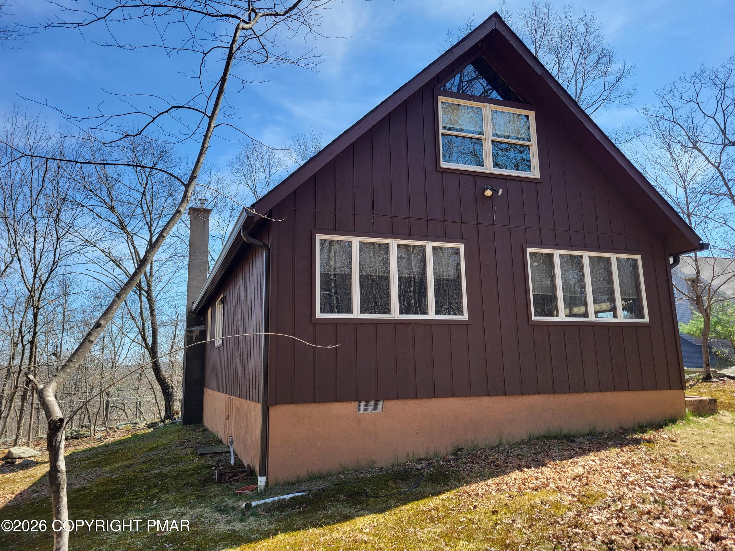155 Clifton Drive Bushkill, PA 18324 - Photo 43 of 75 a front view of a house with a yard