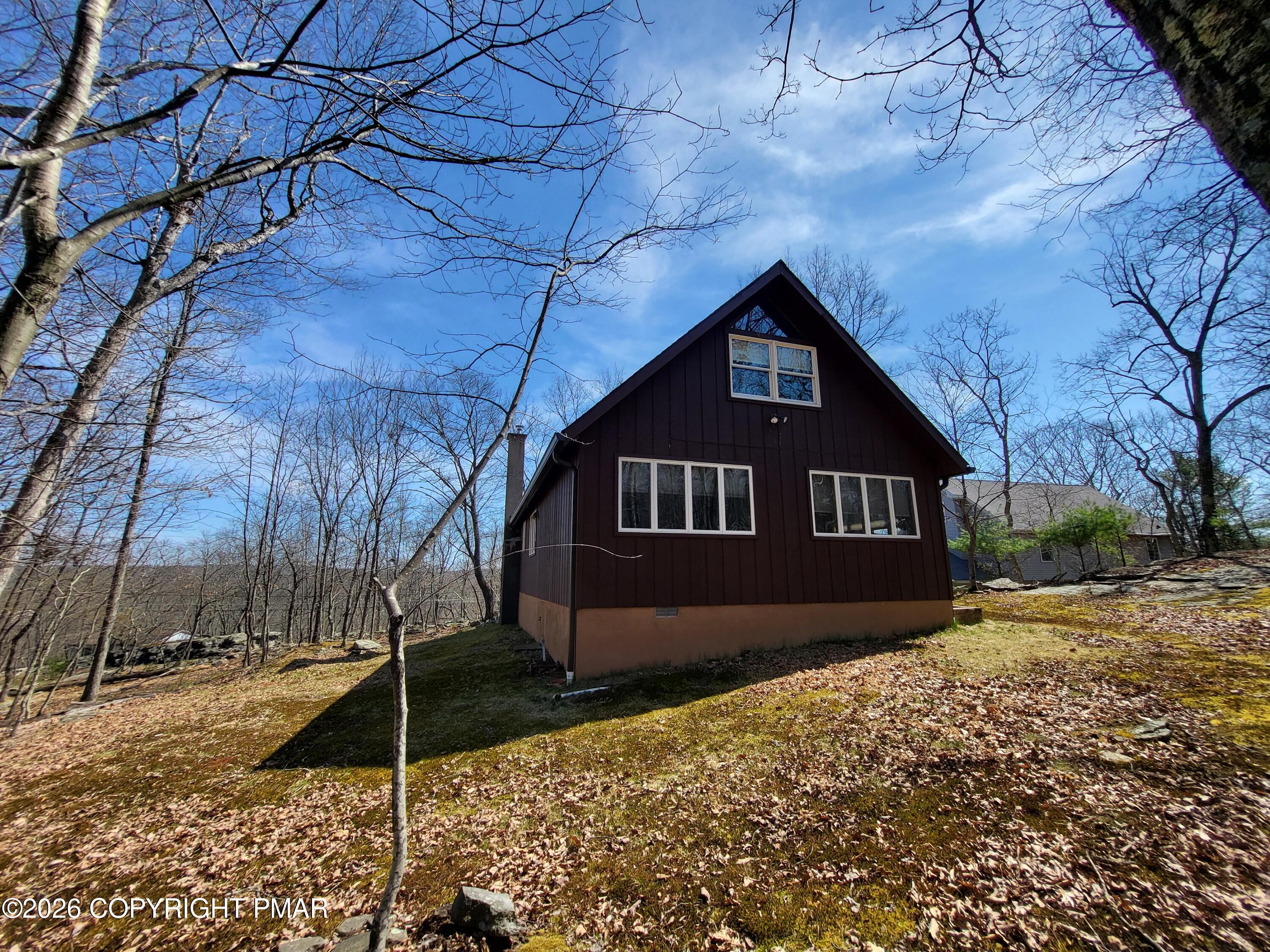 155 Clifton Drive Bushkill, PA 18324 - Photo 44 of 75 a front view of a house with a yard