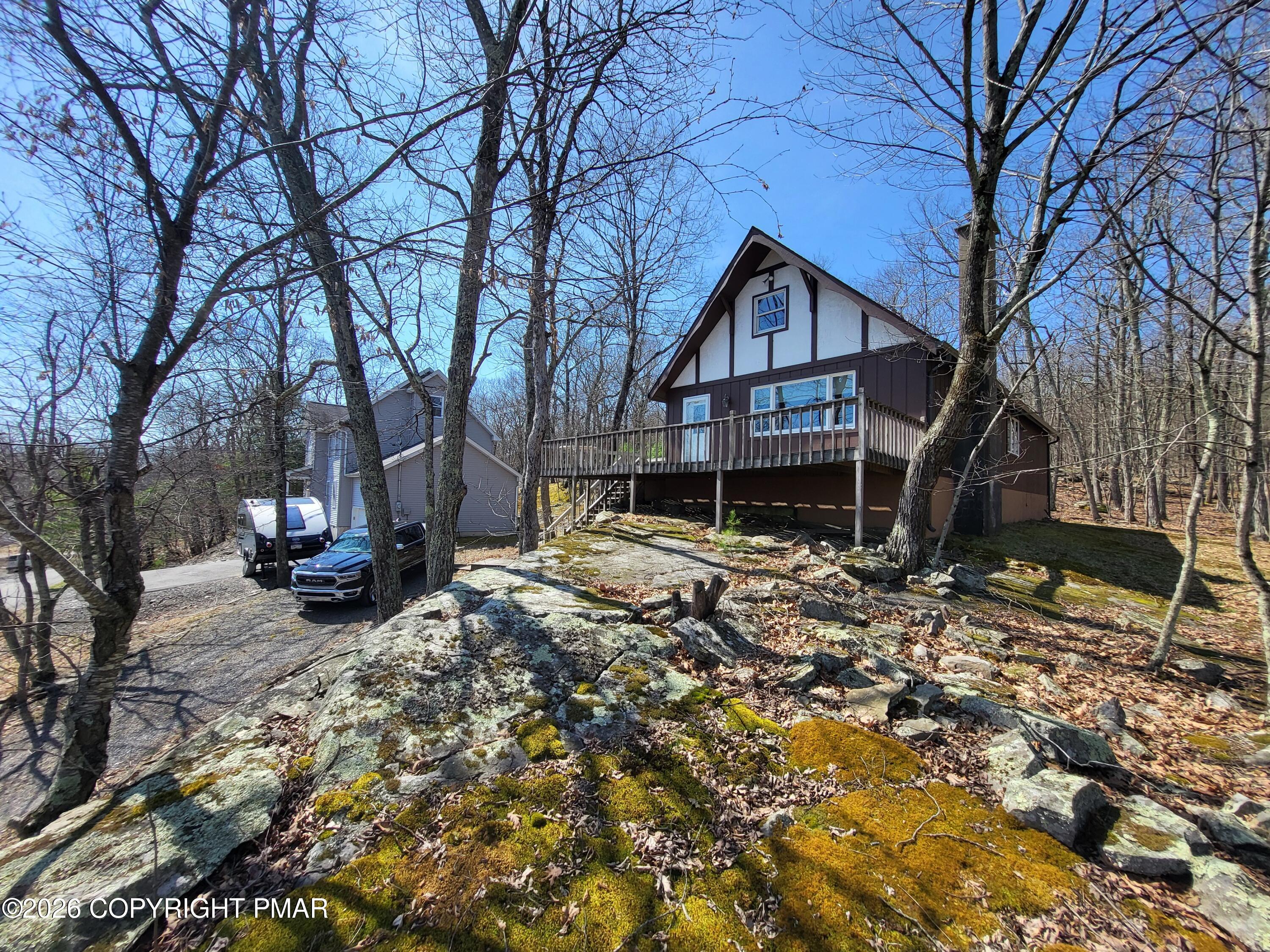 155 Clifton Drive Bushkill, PA 18324 - Photo 45 of 75 a house that has a tree in front of it