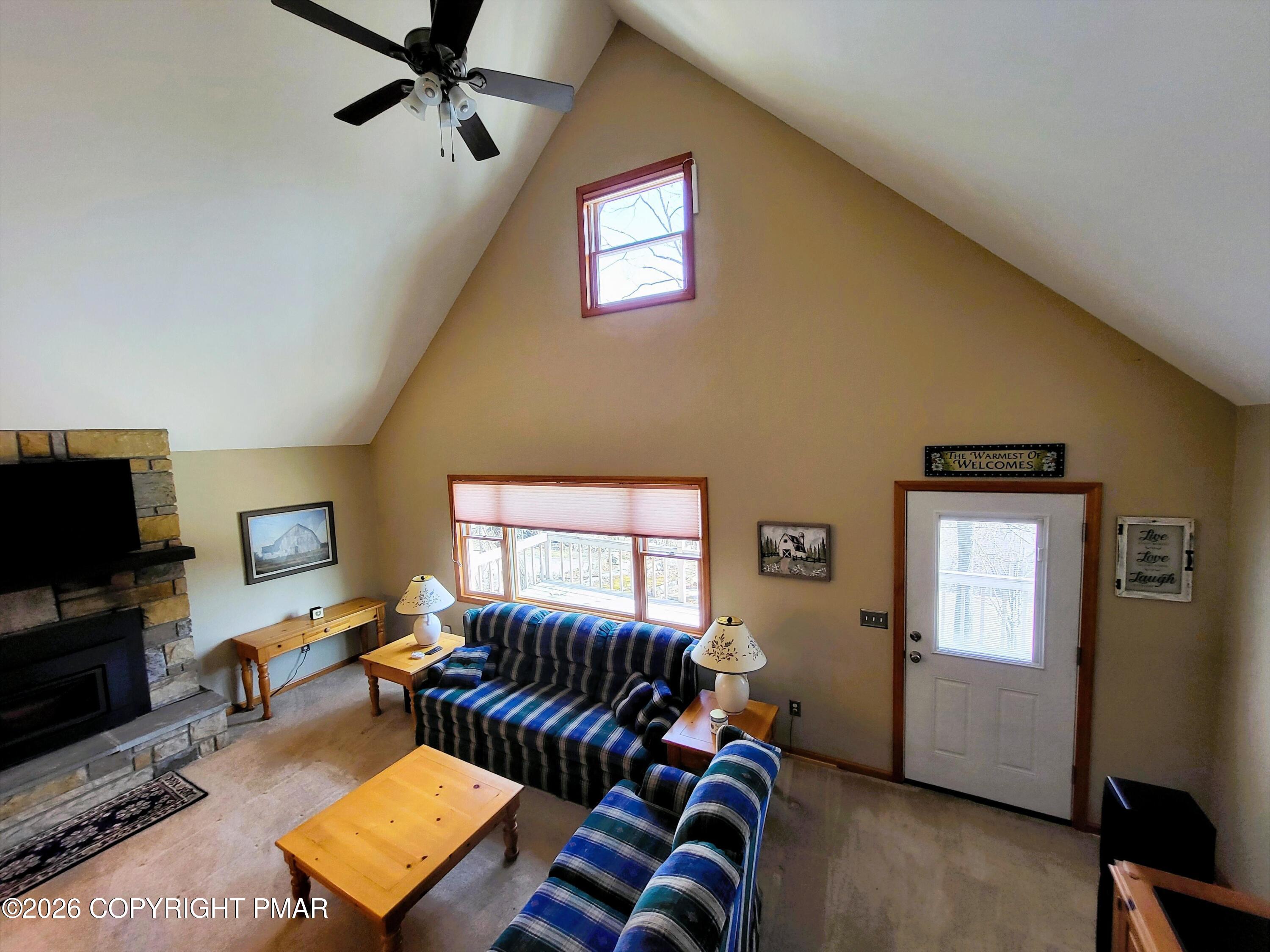 155 Clifton Drive Bushkill, PA 18324 - Photo 6 of 75 a living room with furniture and a flat screen tv