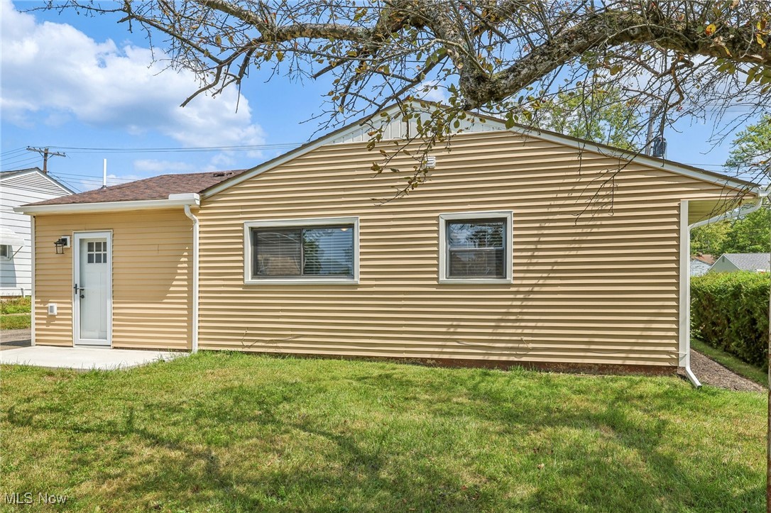38 Rutledge Drive Youngstown, OH 44505 - Photo 19 of 32 Rear view of property featuring a patio area and a yard