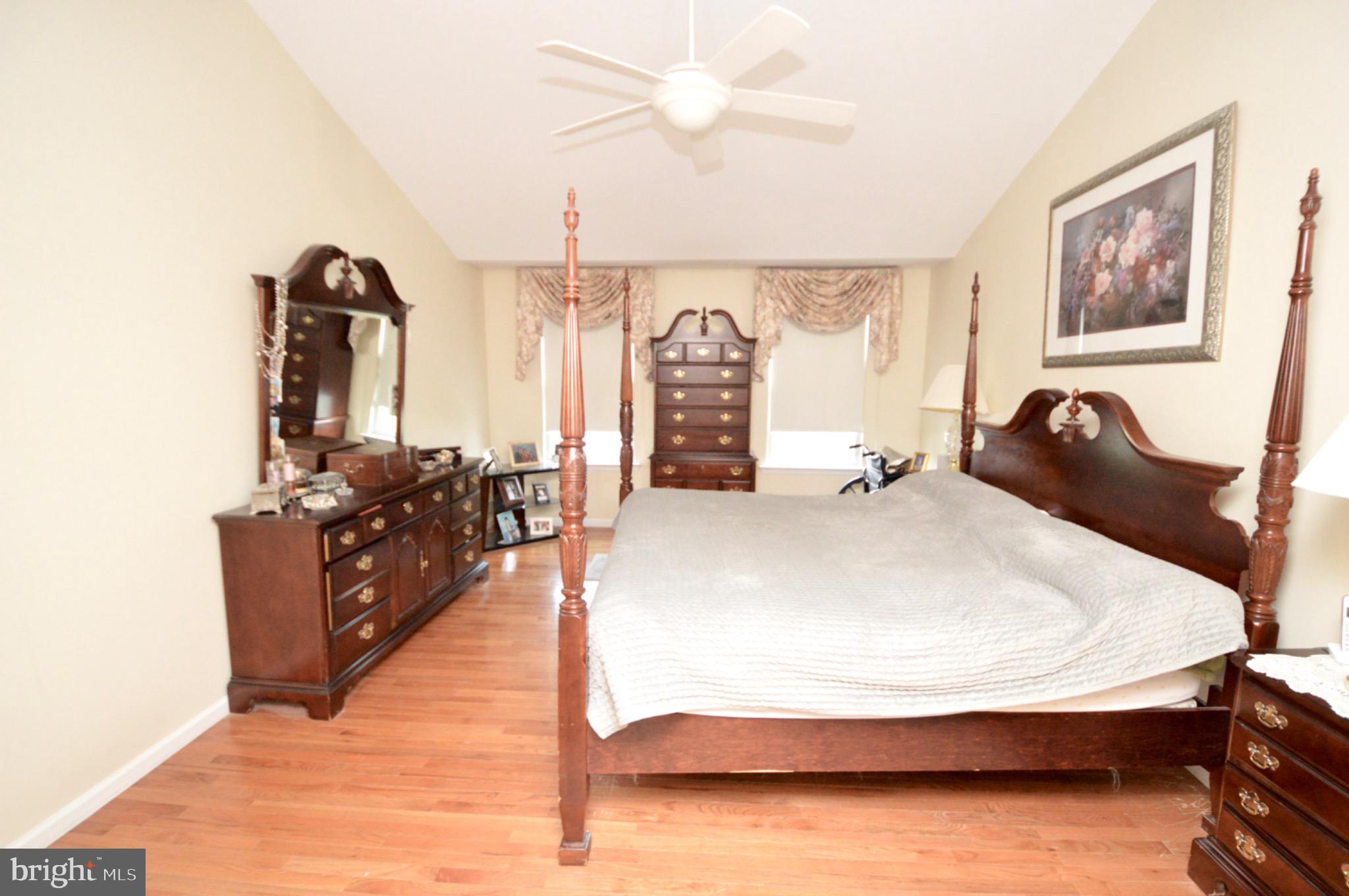 8 Toby Wells Court Delran, NJ 08075 - Photo 12 of 23 a spacious bedroom with a bed and wooden floor