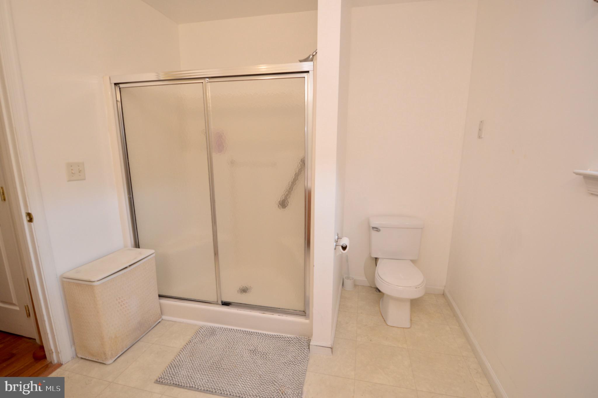 8 Toby Wells Court Delran, NJ 08075 - Photo 13 of 23 a bathroom with a toilet and a shower