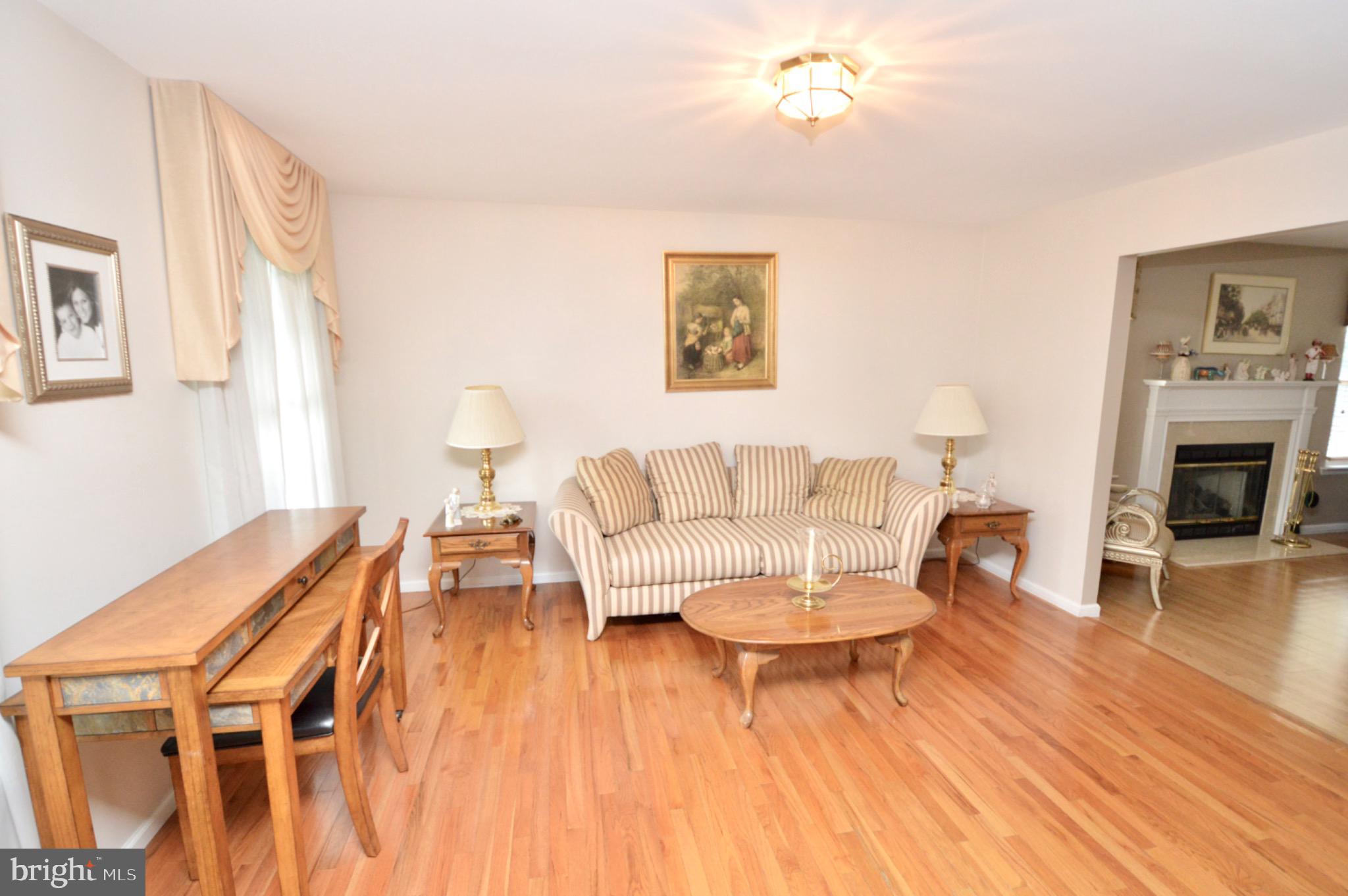 8 Toby Wells Court Delran, NJ 08075 - Photo 3 of 23 a living room with furniture a fireplace and wooden floor