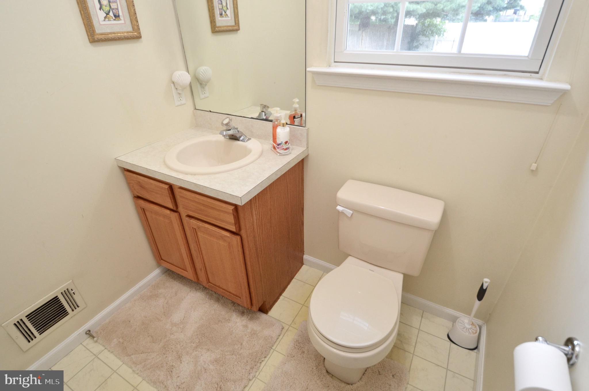 8 Toby Wells Court Delran, NJ 08075 - Photo 10 of 23 a white toilet sitting next to a bathroom sink