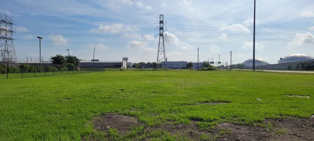 a view of a patio with a table and chairs