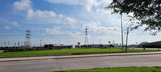 a view of a swimming pool with a yard