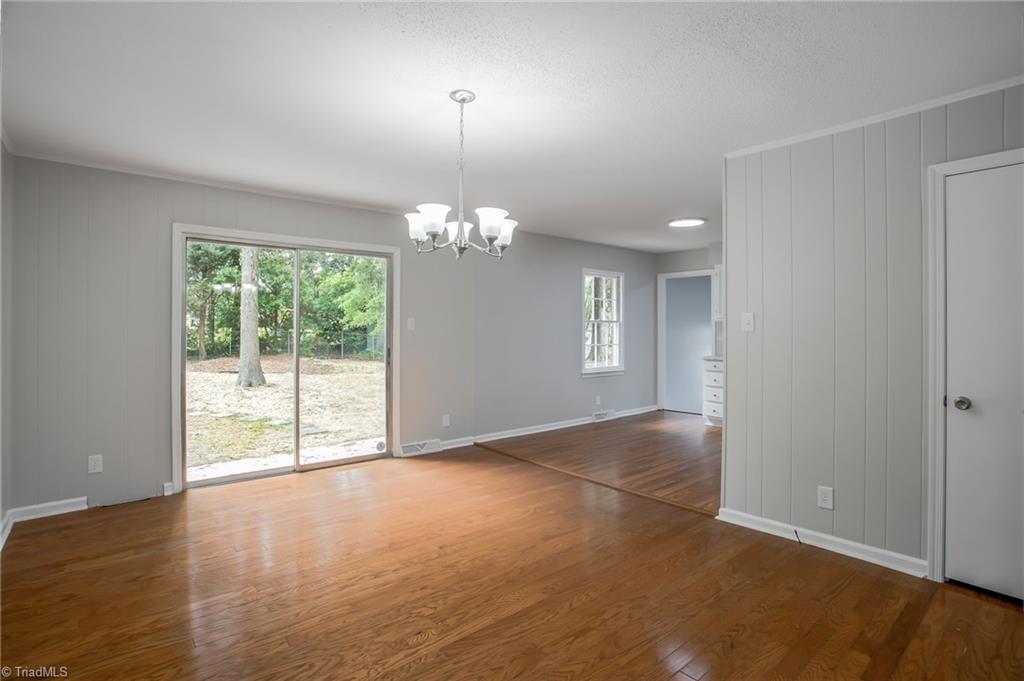 1712 Bolingbroke Road High Point, NC 27265 - Photo 6 of 23 The large dining room is ready for entertaining. The sliding glass door helps bring the outside in.