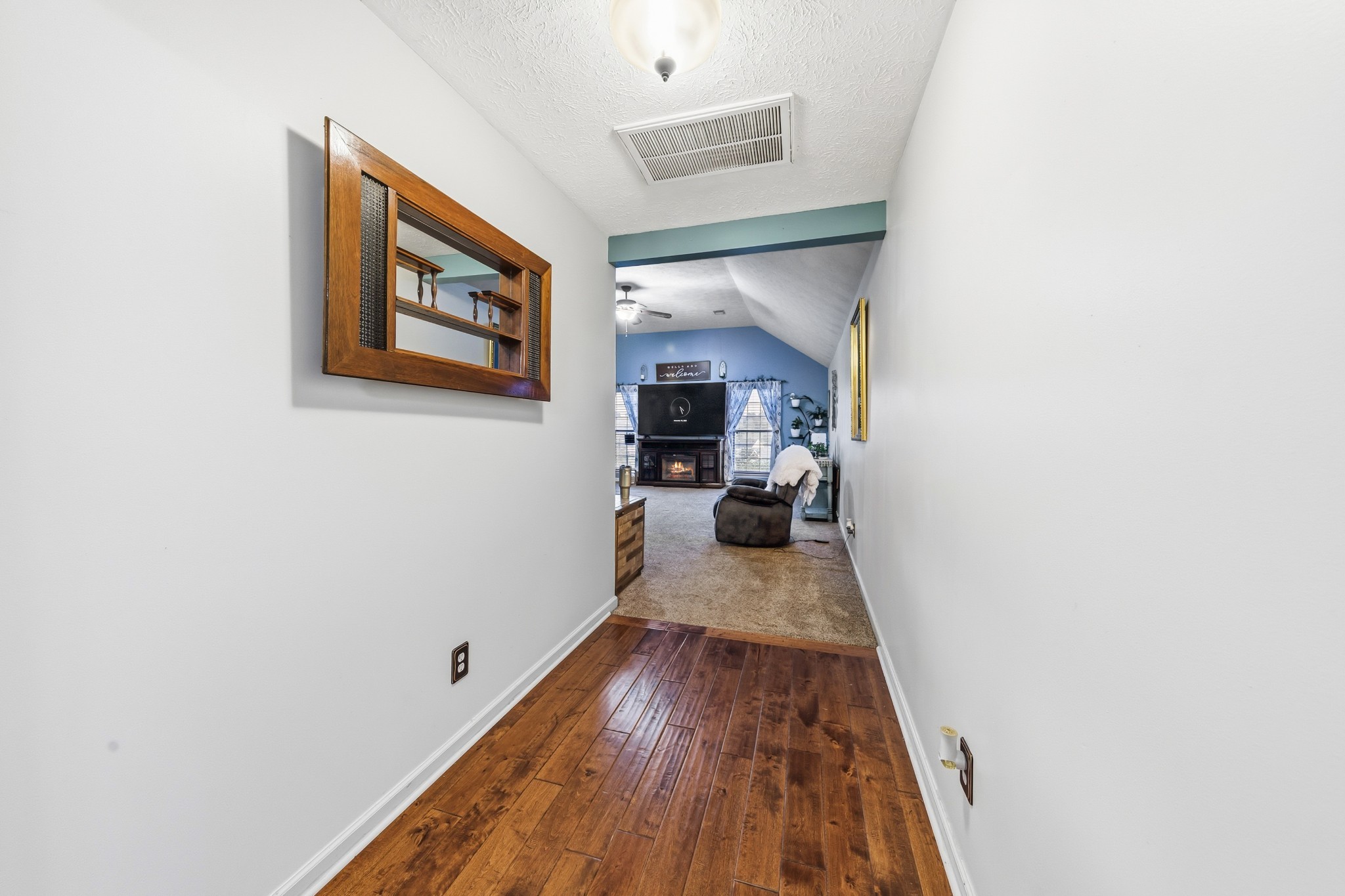 699 Puckett Road Watertown, TN 37184 - Photo 23 of 53 a view of a hallway with wooden floor and a living room