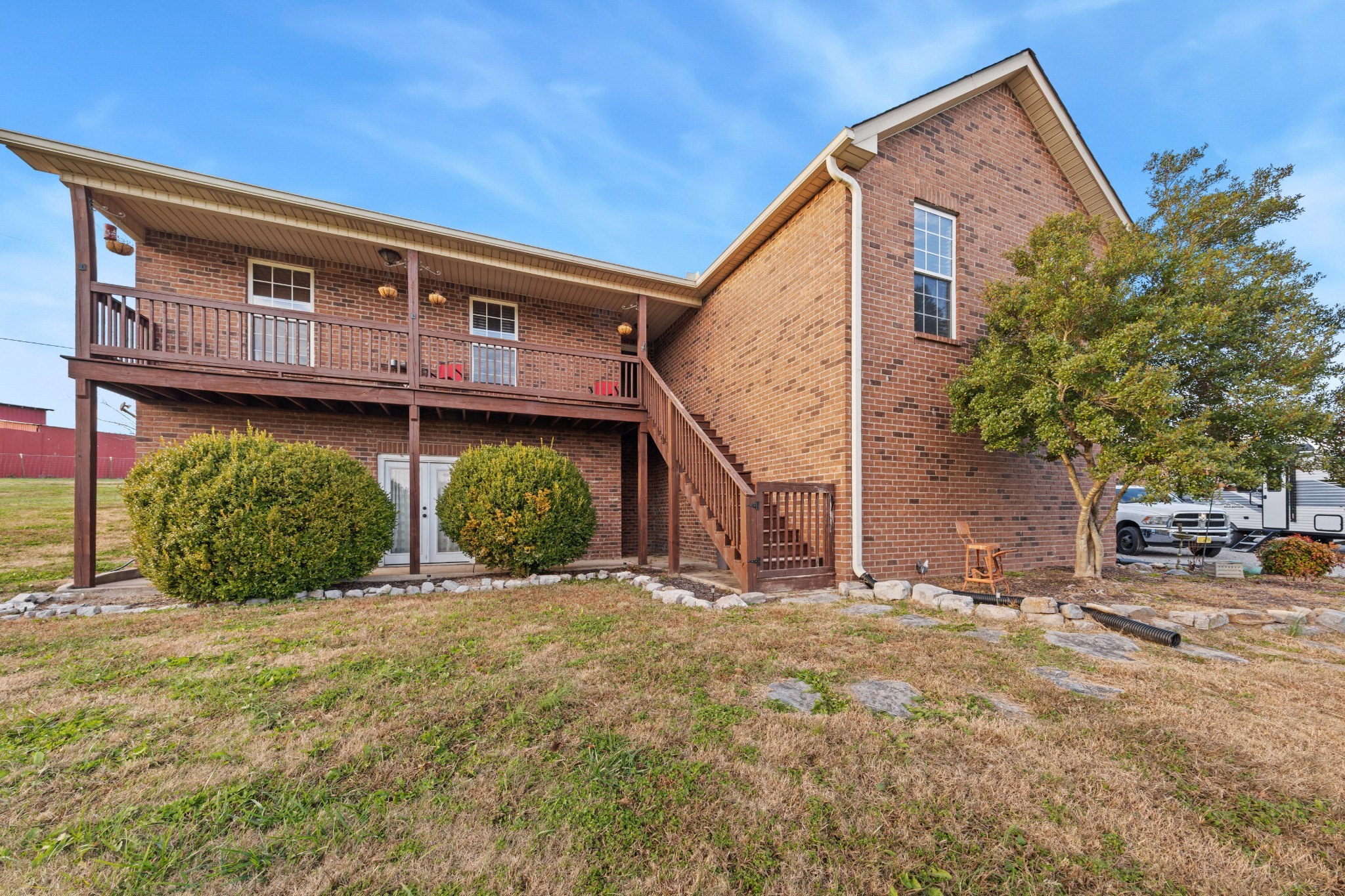 699 Puckett Road Watertown, TN 37184 - Photo 48 of 53 a view of a house with large windows and a small yard