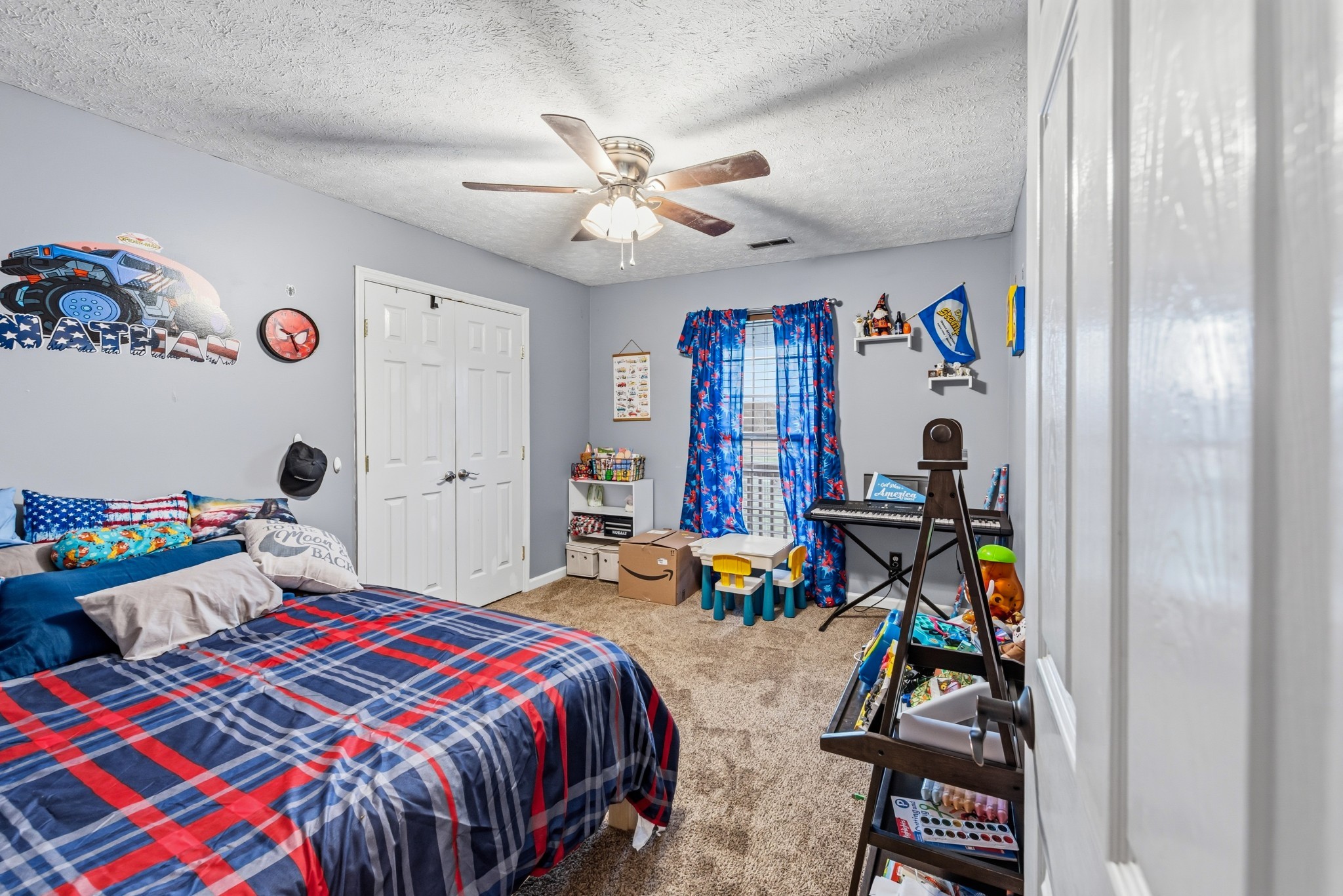 699 Puckett Road Watertown, TN 37184 - Photo 7 of 53 a bedroom with a bed and a chandelier