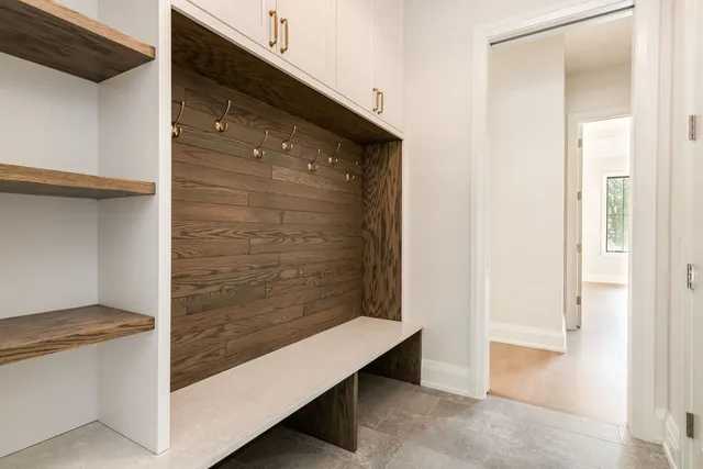 a view of hallway with wooden floor