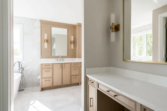 a bathroom with a glass shower door