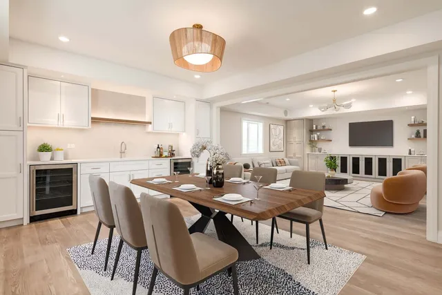 a view of kitchen with cabinets table and chairs