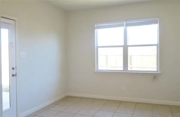 a kitchen with stainless steel appliances a refrigerator and a stove top oven