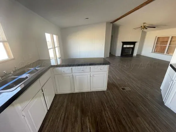 a room with wooden cabinets and a wooden floor