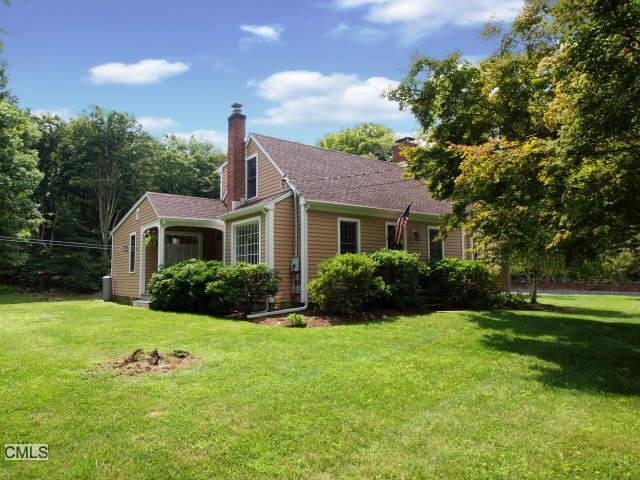 139 Boggs Hill Road Newtown, CT 06470 - Photo 1 of 1 a front view of a house with garden