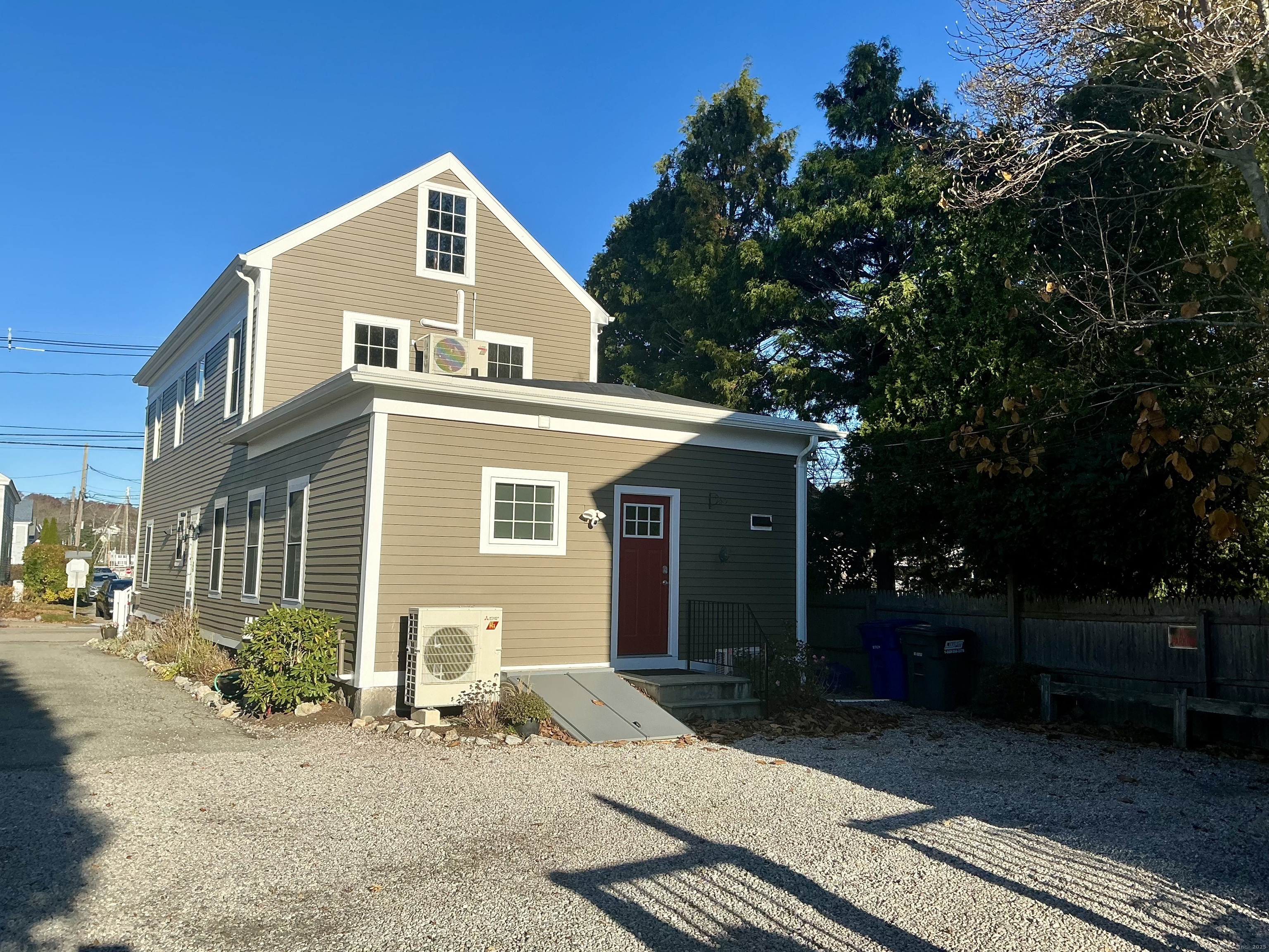 17 Willow Street, Unit 2 Mystic, CT 06355 - Photo 3 of 20 a front view of a house with a yard