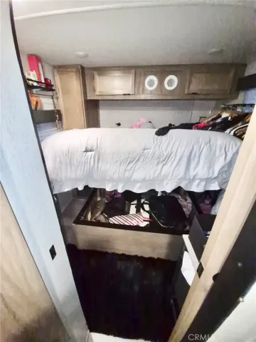 a bed room with a bed and a chair