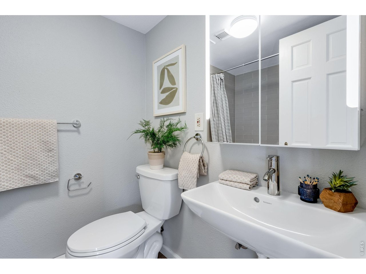 3473 28th Street, Unit 12 Boulder, CO 80301 - Photo 14 of 39 a bathroom with a sink toilet and shower