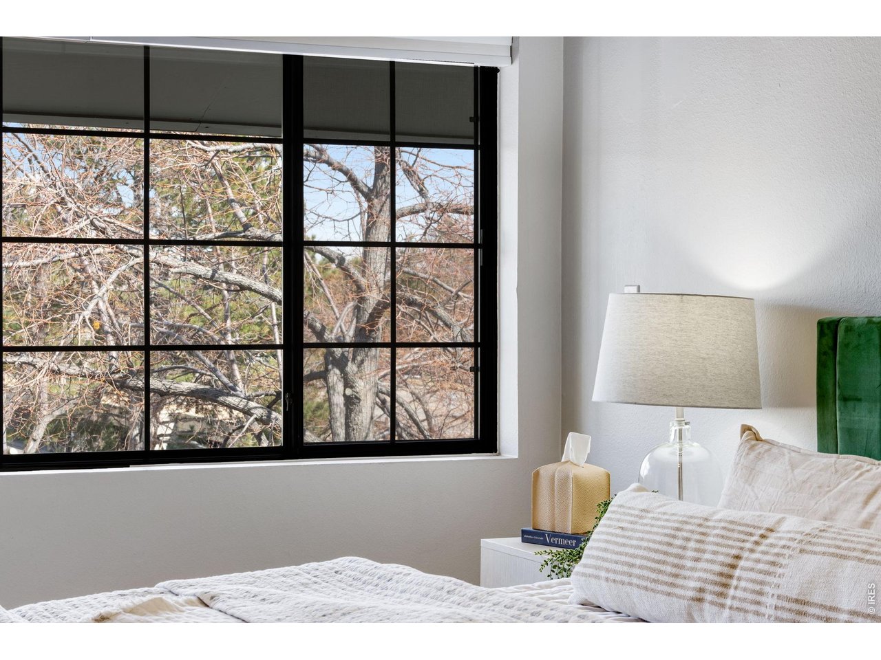 3473 28th Street, Unit 12 Boulder, CO 80301 - Photo 17 of 39 a bedroom with a bed and a window