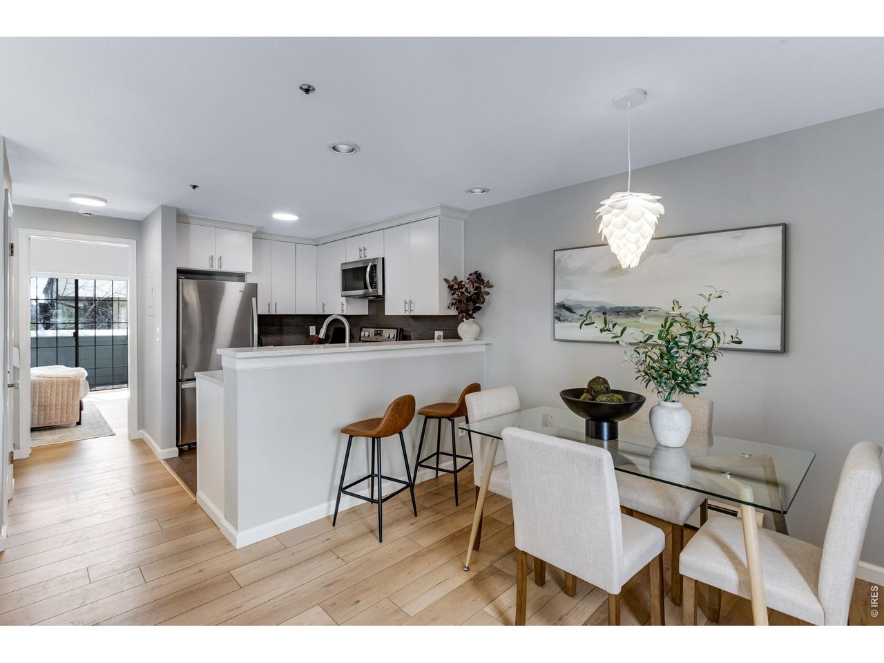 3473 28th Street, Unit 12 Boulder, CO 80301 - Photo 5 of 39 a view of kitchen with refrigerator dining table and chairs