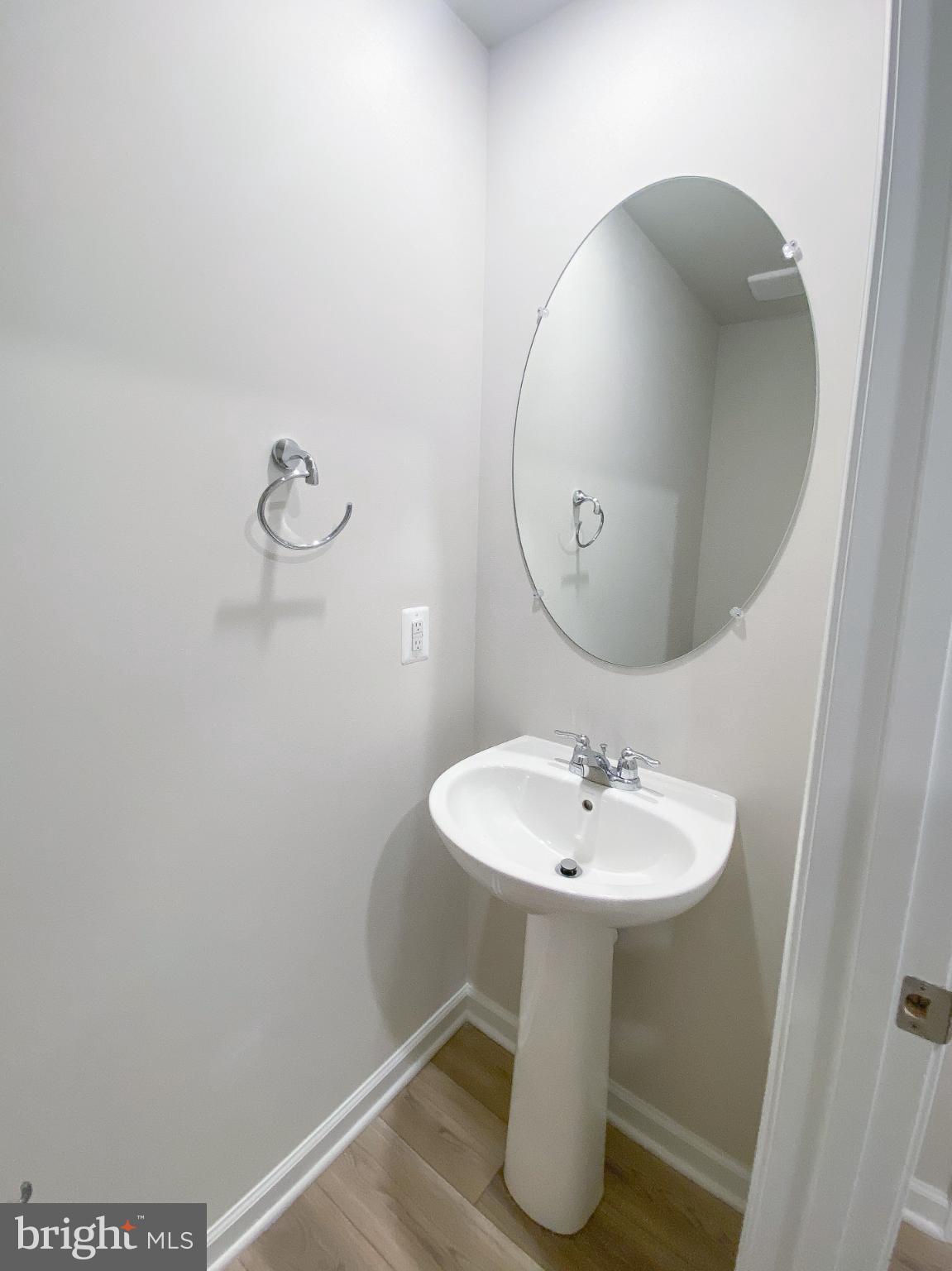 141 Canning Road Inwood, WV 25428 - Photo 14 of 29 a bathroom with a sink and a mirror
