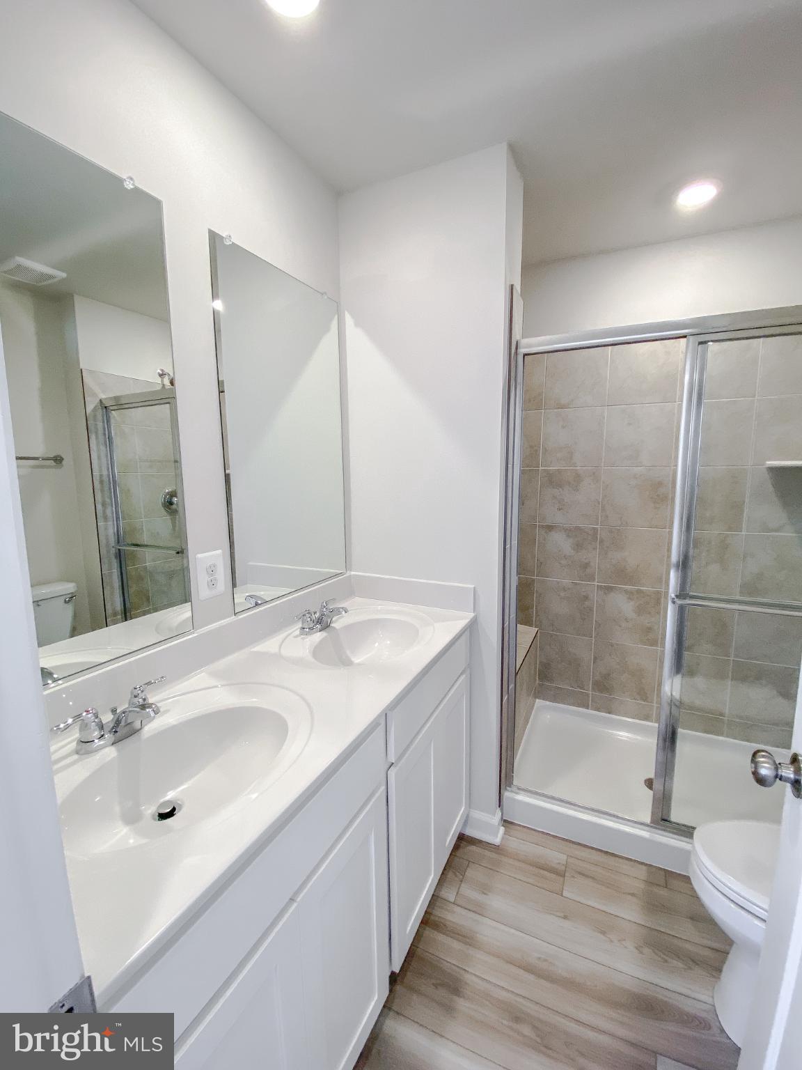 141 Canning Road Inwood, WV 25428 - Photo 18 of 29 a bathroom with a sink and a mirror