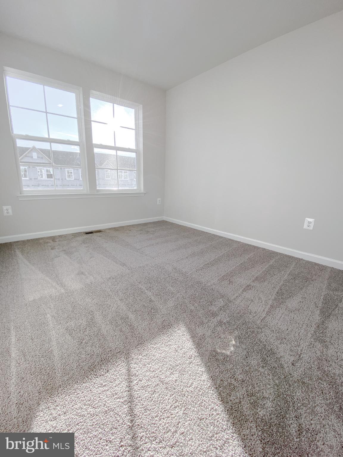 141 Canning Road Inwood, WV 25428 - Photo 26 of 29 an empty room with windows