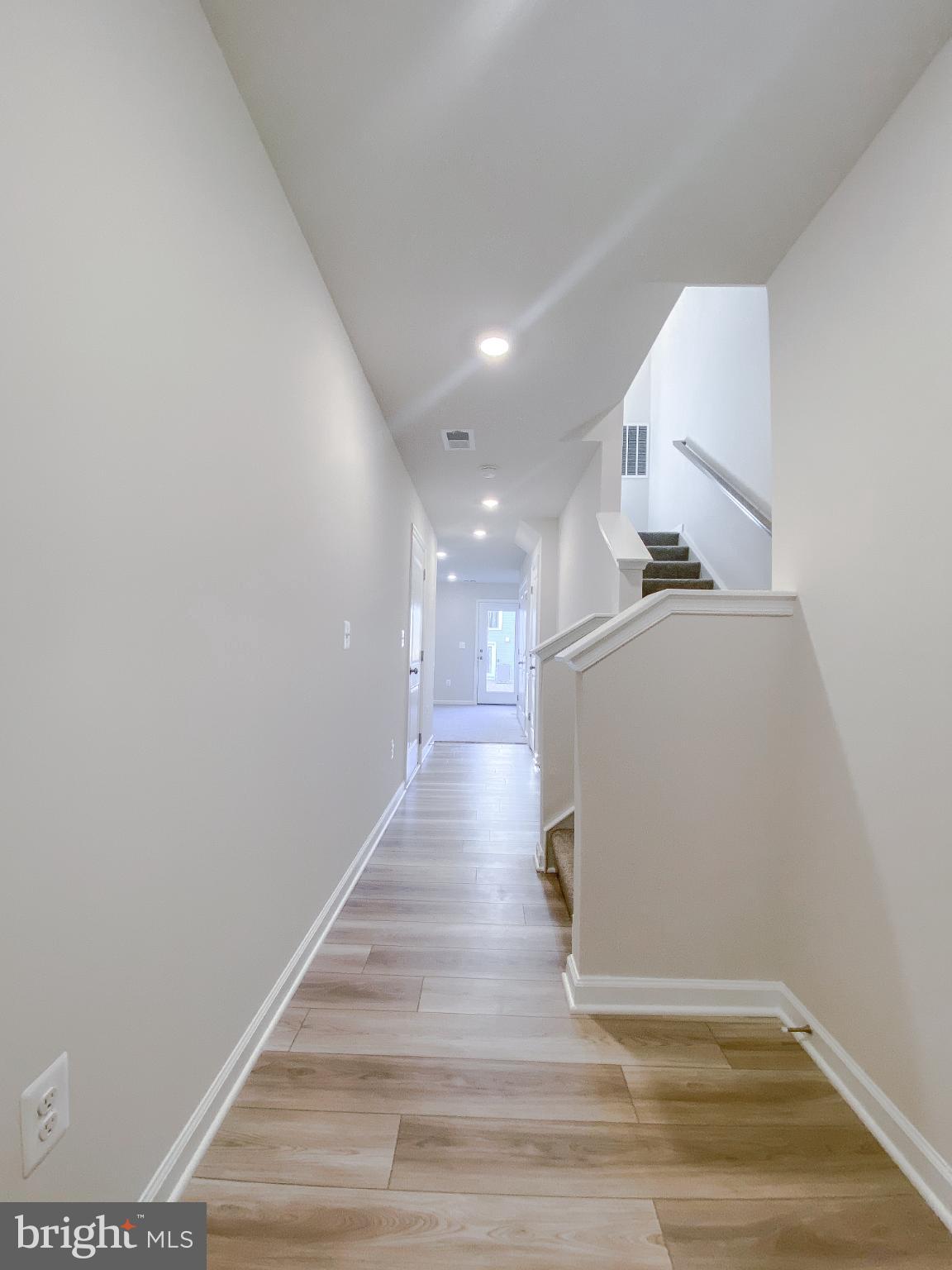 141 Canning Road Inwood, WV 25428 - Photo 4 of 29 a view of a hallway with wooden floor
