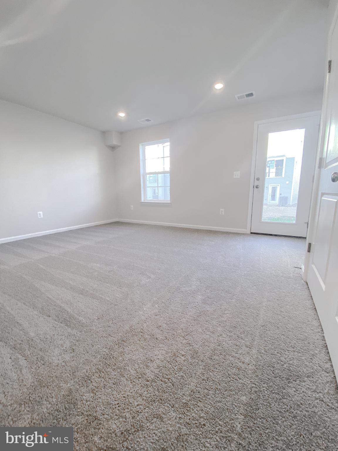 141 Canning Road Inwood, WV 25428 - Photo 6 of 29 an empty room with windows