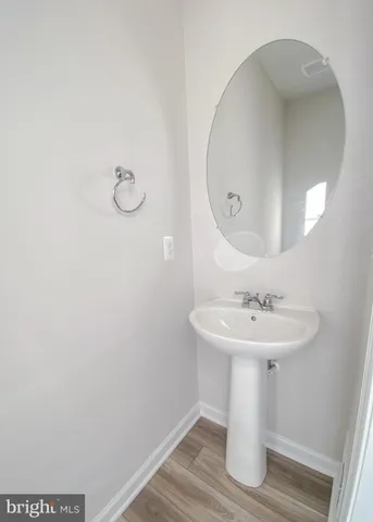 a bathroom with a sink a mirror and vanity