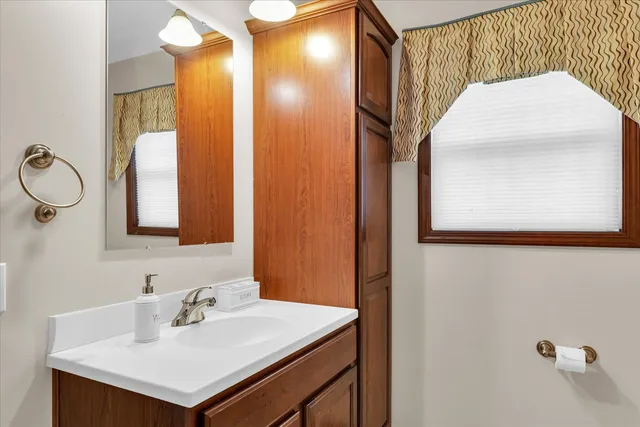 a bathroom with a sink toilet and vanity