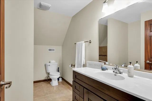 a view of a patio with a table chairs and a table