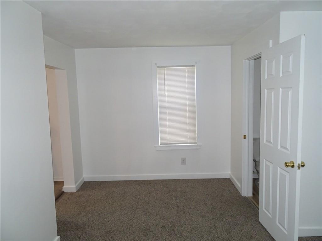 42 Oak Street Manor, PA 15665 - Photo 11 of 39 a view of an empty room with windows