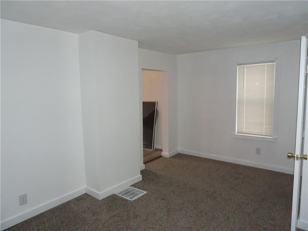 42 Oak Street Manor, PA 15665 - Photo 12 of 39 an empty room with windows
