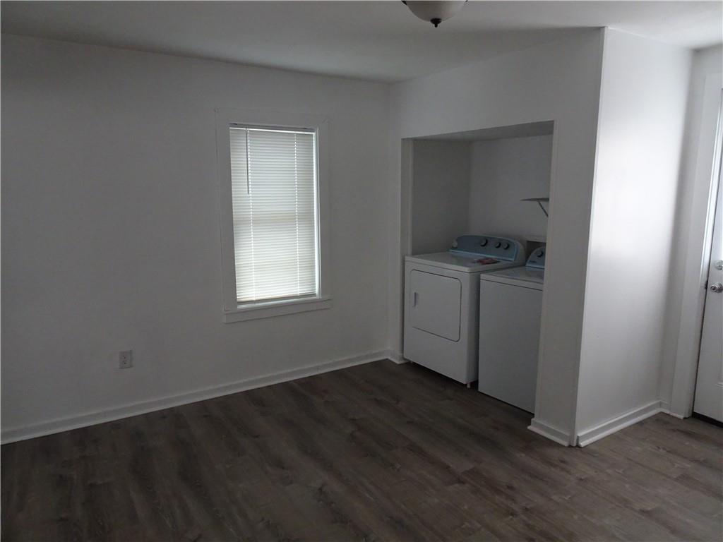 42 Oak Street Manor, PA 15665 - Photo 19 of 39 an empty room with wooden floor cabinet and windows