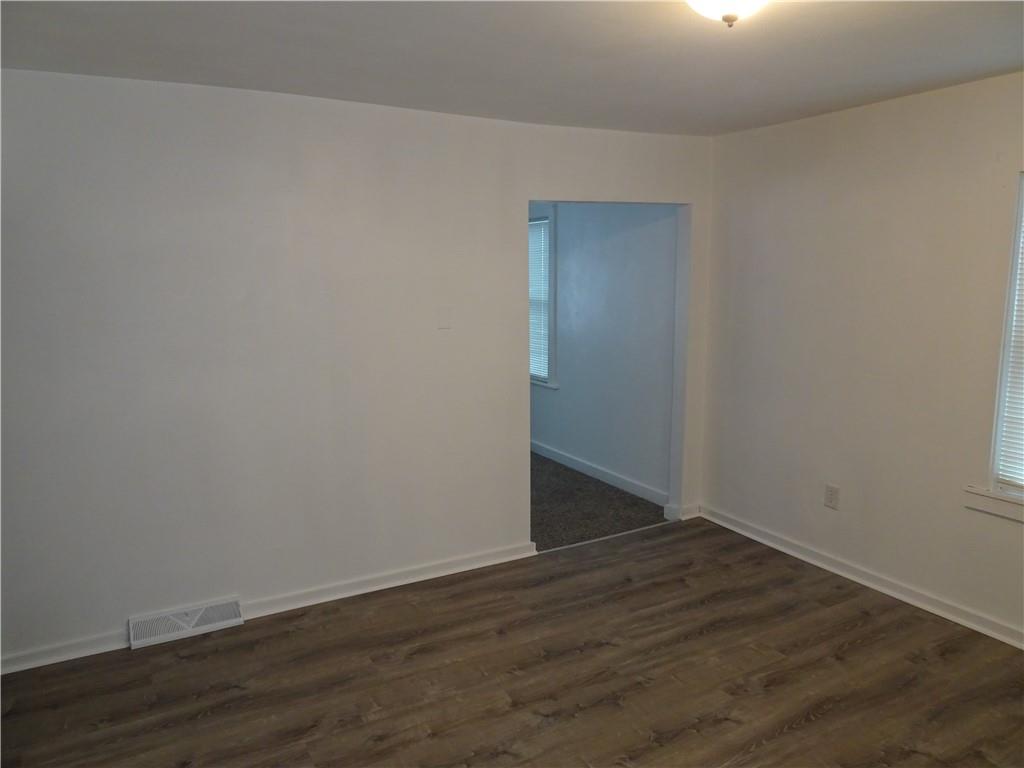 42 Oak Street Manor, PA 15665 - Photo 20 of 39 a view of an empty room with wooden floor and closet
