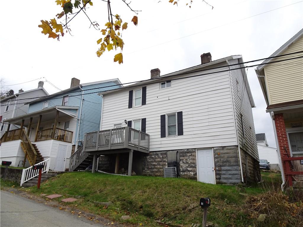 42 Oak Street Manor, PA 15665 - Photo 2 of 39 a view of a house with a backyard