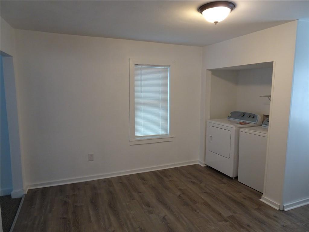 42 Oak Street Manor, PA 15665 - Photo 21 of 39 an empty room with wooden floor cabinet and windows