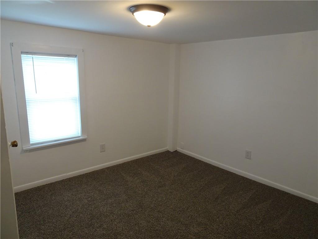 42 Oak Street Manor, PA 15665 - Photo 26 of 39 an empty room with a window
